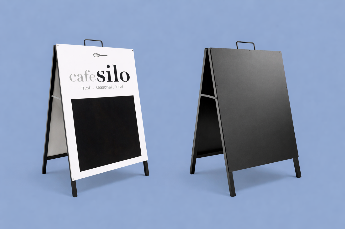 Two sandwich boards with one displaying 'cafe silo' branding on a blue background by SYKESPRINT